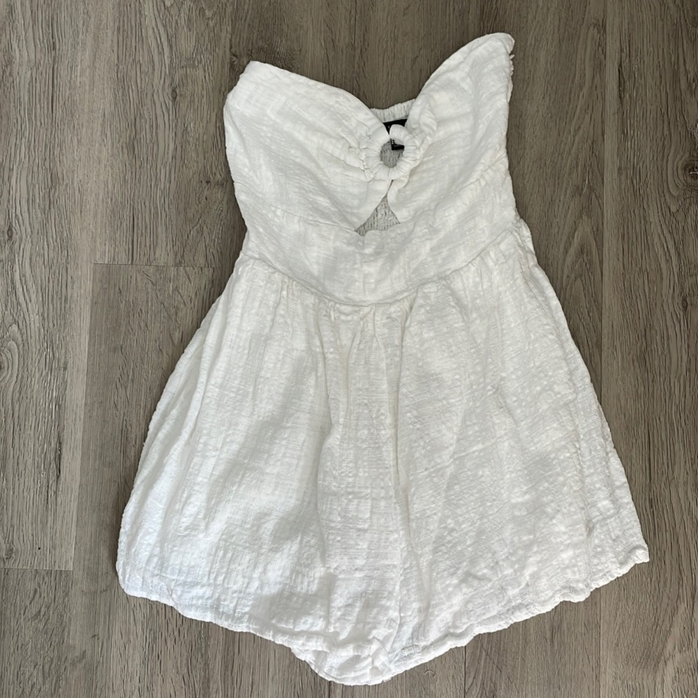 White linen sleeveless romper with ruche back